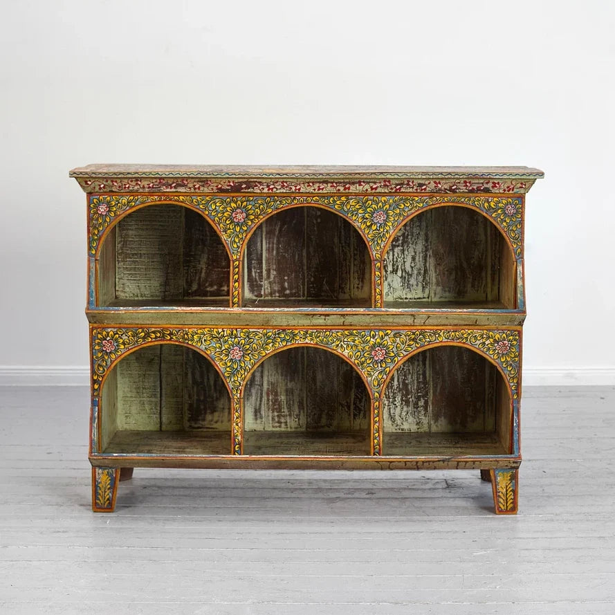 Decorative wooden cabinet with floral patterns on a white background