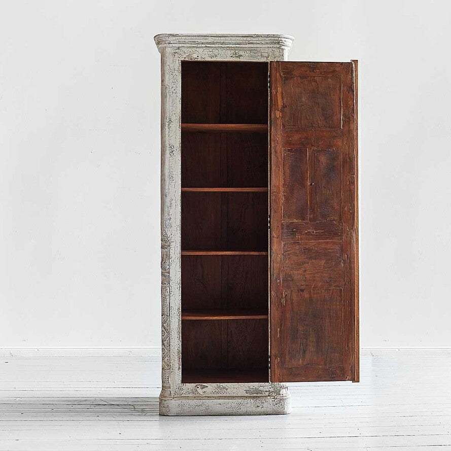 Wooden cabinet with one door open on a white background
