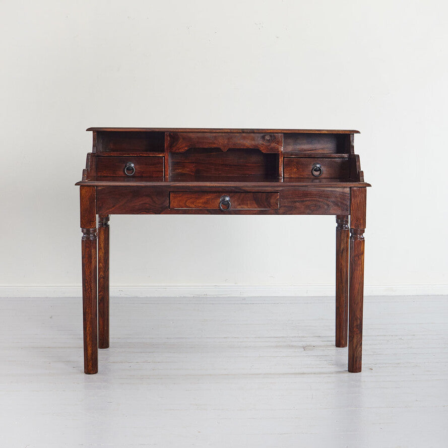 Wooden desk with drawers on a white background