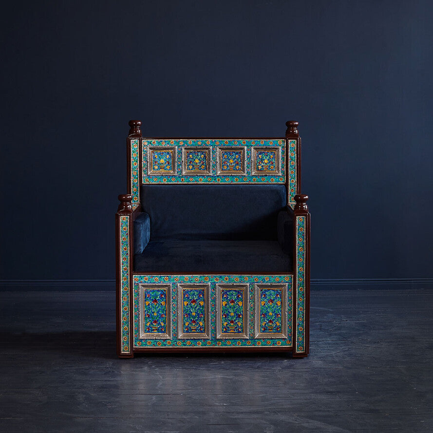 Decorative chair with intricate patterns on a dark background