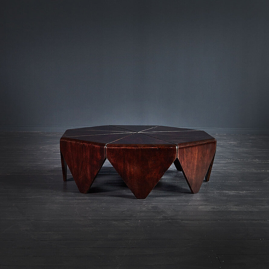 Geometric wooden table on a dark gray background