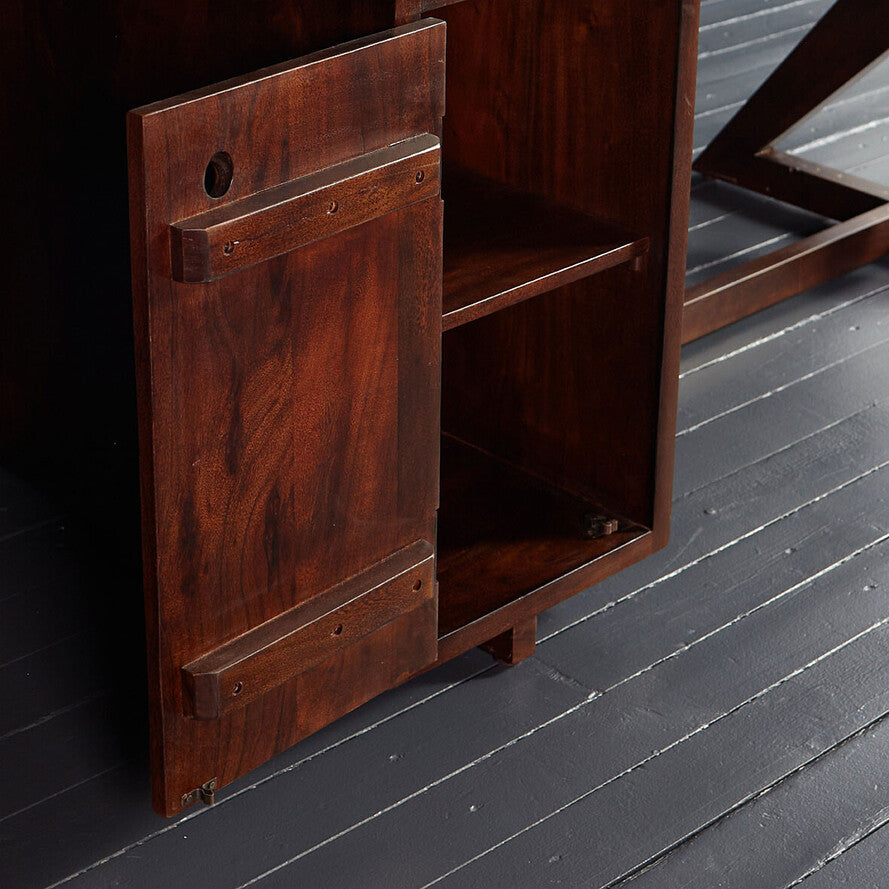 Wooden cabinet with a dark finish on a black wooden floor
