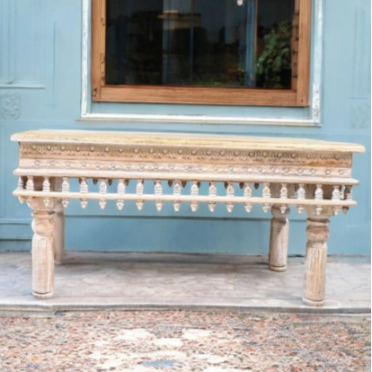 White coffee table in a bright, contemporary living space.
