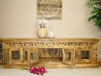 hand carved tv unit, solid mango wood tv stand, glossy timber tv unit, natural wood media console, openwork carved tv stand, 6 door tv unit, glass door tv stand, living room tv unit, entertainment center, tv cabinet, carved wood furniture, traditional tv stand, indian carved tv unit, statement media console, large tv stand, storage tv unit, handmade tv console, artisan made tv unit, premium wood furniture, quality wood tv stand, durable tv unit, sturdy media console, timeless tv stand, elegant tv unit, gran