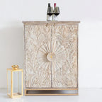 hand carved bar cabinet, mango wood bar cabinet, bar cabinet on stand, metal stand cabinet, sunburst carved cabinet, natural finish cabinet, wine cabinet, liquor cabinet, home bar cabinet, dining room bar cabinet, living room bar cabinet, storage cabinet, 2 door cabinet, drawer cabinet, handmade bar cabinet, artisan made cabinet, premium wood cabinet, quality wood furniture, durable bar cabinet, sturdy cabinet, timeless bar cabinet, elegant cabinet, statement bar cabinet, industrial style cabinet, modern ba