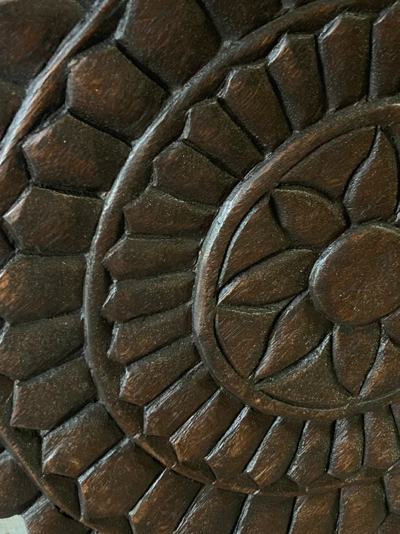 hand carved wall panel, solid wood wall art, round wall panel, circular wall art, dark brown panel, lotus medallion panel, mandala wall art, radiating lotus, indian furniture, entryway wall art, meditation wall decor, small wall panel, decorative wall panel, handmade wall art, artisan made panel, premium wood art, quality wood decor, durable wall panel, solid wood panel, sturdy wall art, timeless wall art, elegant panel, statement wall decor, accent wall art, unique wall art, sculptural panel, focal piece a