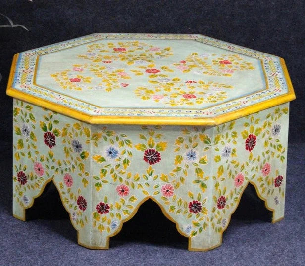hand painted coffee table, mango wood coffee table, octagonal coffee table, floral coffee table, painted wood table, colorful coffee table, bohemian table, indian furniture, living room table, statement coffee table, handmade coffee table, artisan made table, premium wood table, quality furniture, durable table, sturdy table, timeless table, elegant table, ornate table, unique table, artistic table, focal piece table, handcrafted in india, sustainable mango wood, hand painted finish, floral botanical motifs
