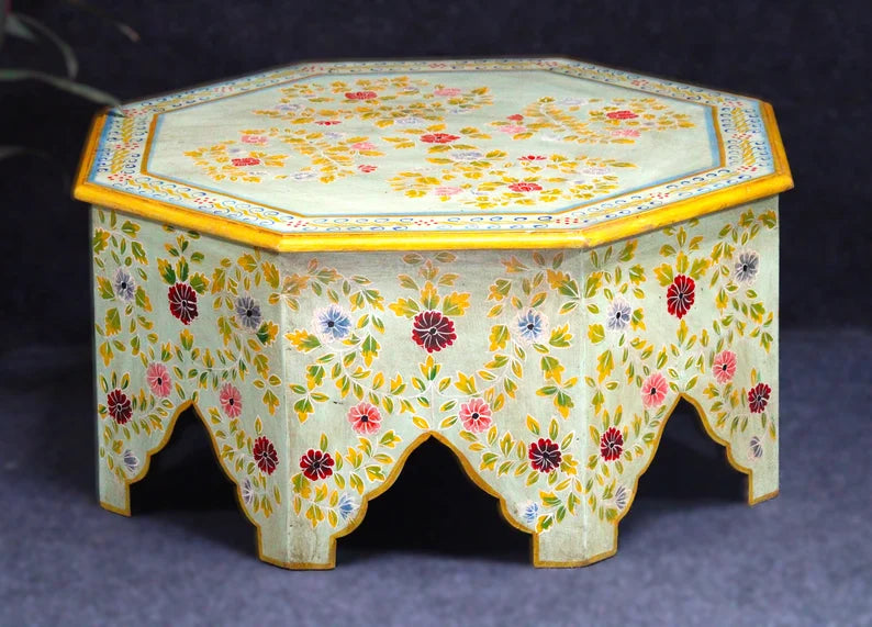 hand painted coffee table, mango wood coffee table, octagonal coffee table, floral coffee table, painted wood table, colorful coffee table, bohemian table, indian furniture, living room table, statement coffee table, handmade coffee table, artisan made table, premium wood table, quality furniture, durable table, sturdy table, timeless table, elegant table, ornate table, unique table, artistic table, focal piece table, handcrafted in india, sustainable mango wood, hand painted finish, floral botanical motifs