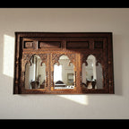 mango wood mirror, carved mirror, jharokha mirror, triple arch mirror, rajasthani mirror, indian mirror, vintage mirror, rustic mirror, antique mirror, distressed mirror, horizontal mirror, wall mirror, statement mirror, architectural mirror, palace mirror, traditional mirror, handmade mirror, artisan mirror, premium mirror, quality mirror, durable mirror, elegant mirror, unique mirror, decorative mirror, focal piece mirror, handcrafted in india, sustainable mango wood, rustic antique, antique finish, multi