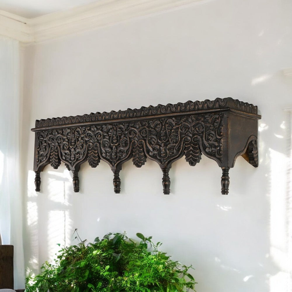 "Decorative wall shelf with ornate hand-carved design, reflecting the craftsmanship of Rajasthan."
