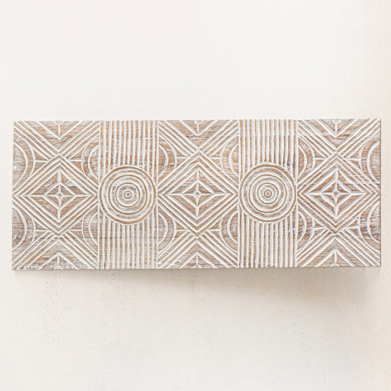 "Single whitewashed wood panel hung vertically as boho wall decor"


