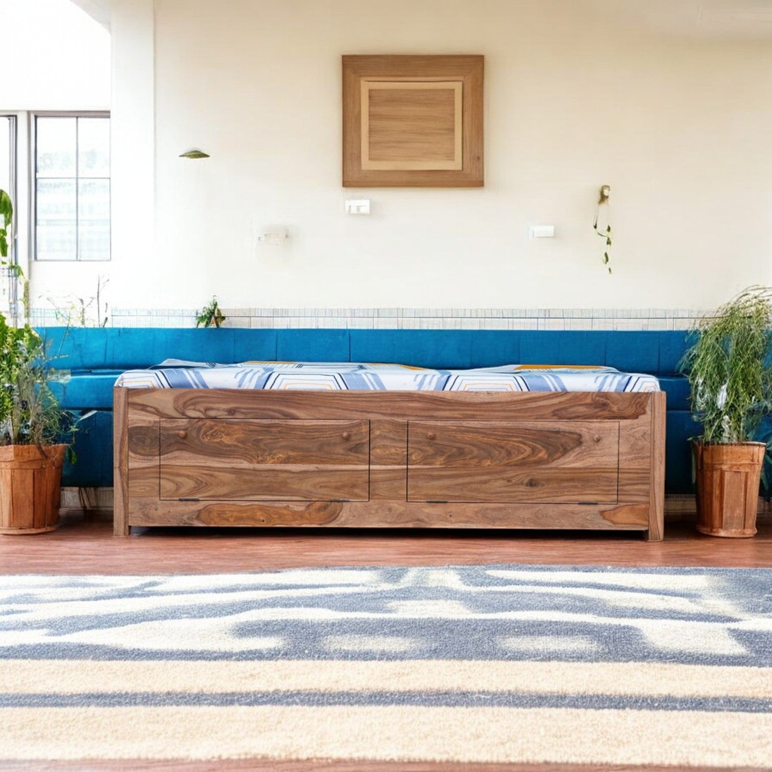 A durable wooden divan bed with intricate craftsmanship.
