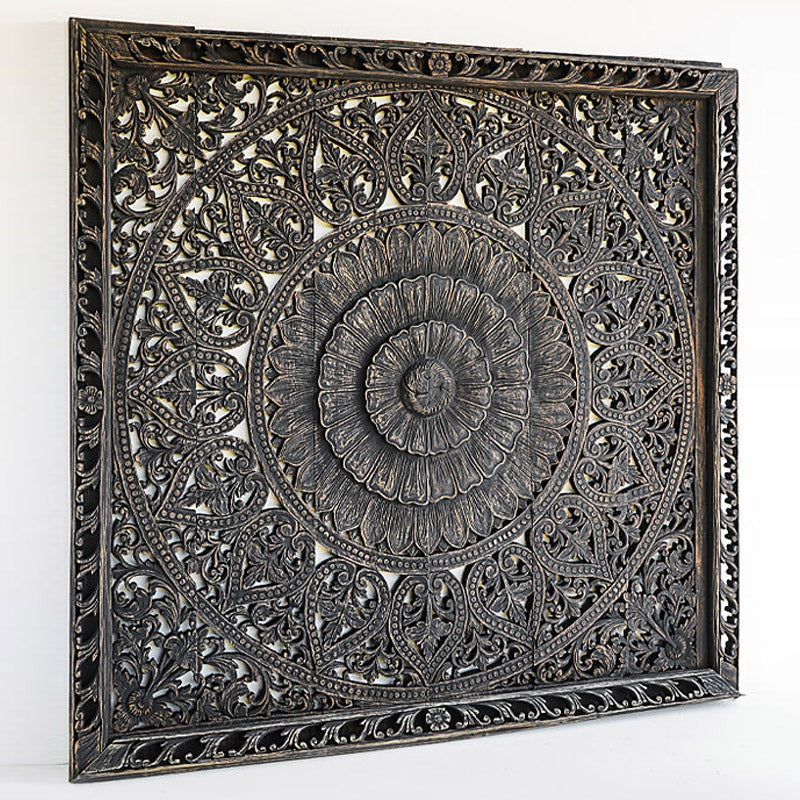"Close-up of artisan distressing showing black finish with raw wood texture highlights"

