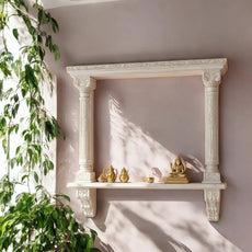 Jodhpur hand-carved white-washed archway wall shelf with columns and corbels. Handcrafted in Jodhpur, Rajasthan. Ideal for pooja display and antique home decor.
