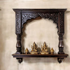 Jodhpur hand-carved dark wood archway pooja shelf with columns and corbels. Handcrafted in Jodhpur, Rajasthan. Ideal for pooja display and antique home decor.