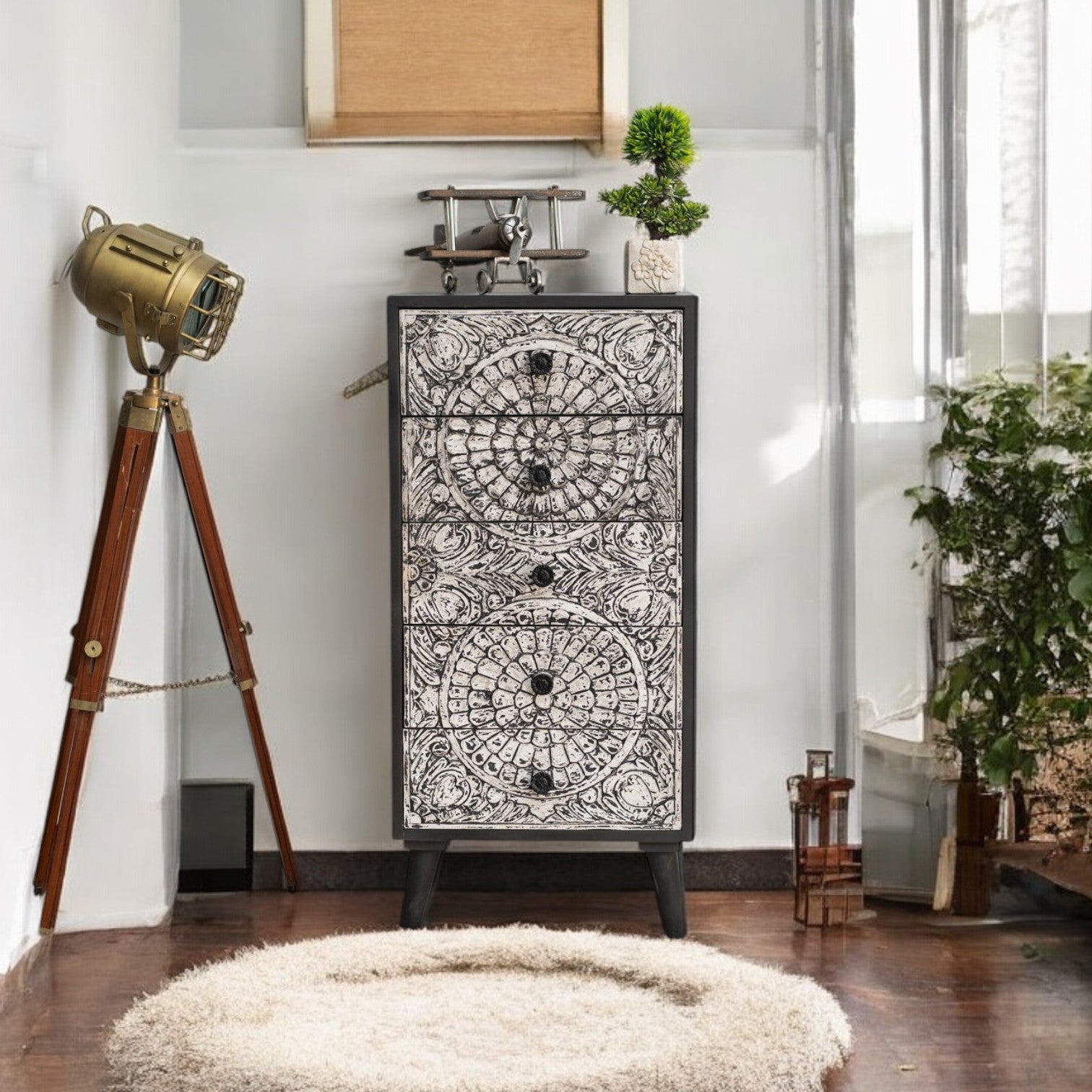 Wooden drawer chest for stylish and functional bedroom storage.
